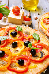 Delicious pizza served on wooden table