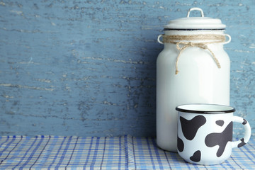 Retro still life with tasty rustic milk, on table