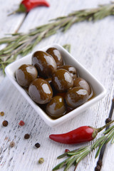 Marinated olives on table close-up