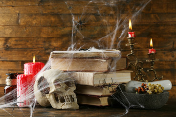 Frightful still life for Halloween, on wooden background