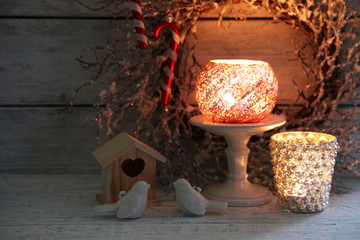 Composition with beautiful candlesticks, Christmas wreath and