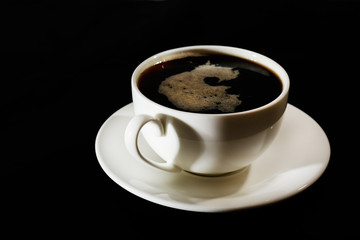 Cup of coffee on black background