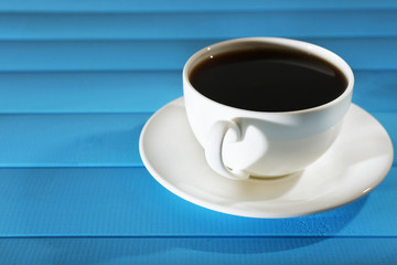 Cup of coffee on wooden table