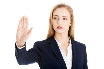 Businesswoman making stop sign