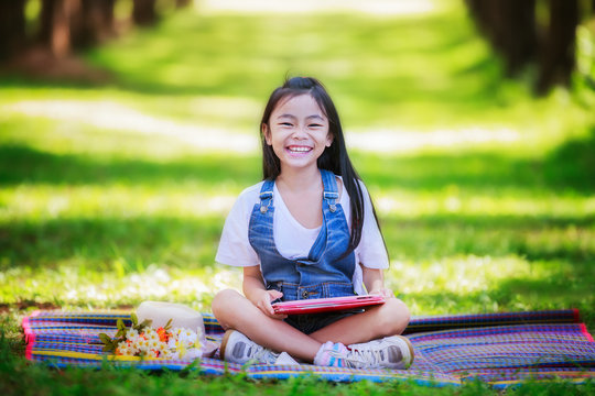 Funny Little Asian Girl Learning