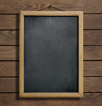 chalkboard or blackboard hanging on wooden wall