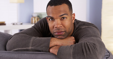 Obraz premium Black man resting on couch