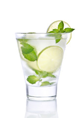 small glass with lemonade, ice, mint and lime. Isolated on white