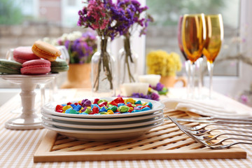 Buffet table with dishware waiting for guests
