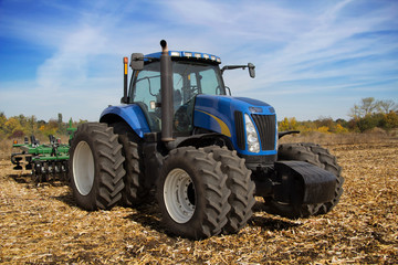 Naklejka premium Modern farm tractor with planter