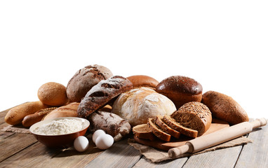 Fresh bread on table on white background