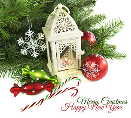 Christmas card with lantern and candies on white