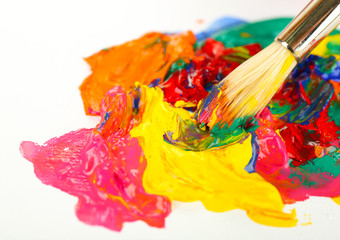 Paint brush with colorful paints, isolated on white