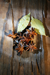 Star anise on dark wooden background, close-up