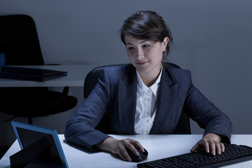 Smiling businesswoman looking at picture
