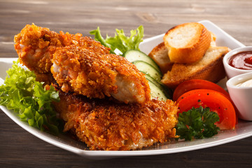 Fried chicken nuggets and vegetables