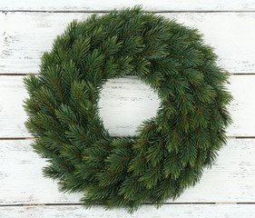 Decorative Christmas wreath on wooden background