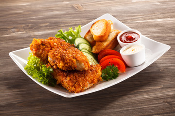 Fried chicken nuggets and vegetables