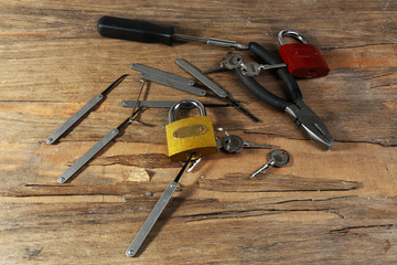Tools of picking locks on wooden table