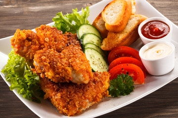 Fried chicken nuggets and vegetables