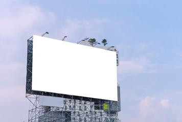 large blank billboard on road with city view background