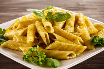 Pasta with pesto sauce, parmesan and vegetables