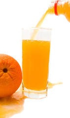 orange with glass of orange juice