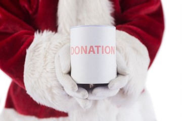 Obraz na płótnie Canvas Santa holds a can for donations