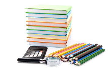 books, calculator, pencils and magnifying glass