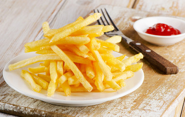 fries on a  wooden board