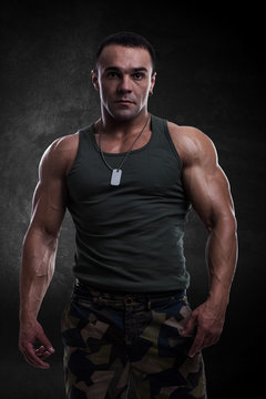Athletic man in military clothing