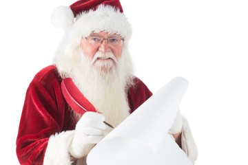 Naklejka premium Santa writes something with a feather