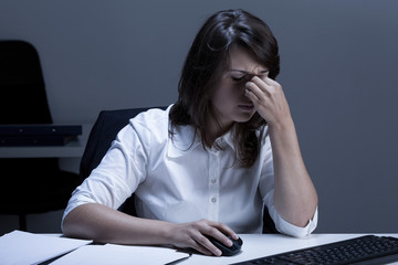 Tired woman using computer