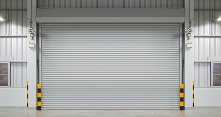 Roller door or roller shutter. Also called security door or security shutter with automatic system. For protection industrial building i.e. factory, warehouse, hangar, workshop, store, hall or garage.