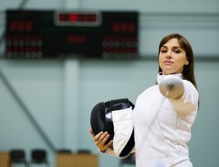 Young woman fencer with epee