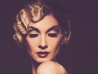Elegant blond retro woman in veil with beautiful hairdo