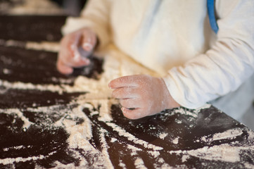 a child plays with the flour