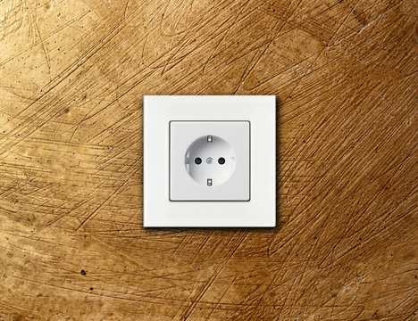 white electric socket on wall