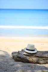 Fototapeta na wymiar Summer straw hat on the beach