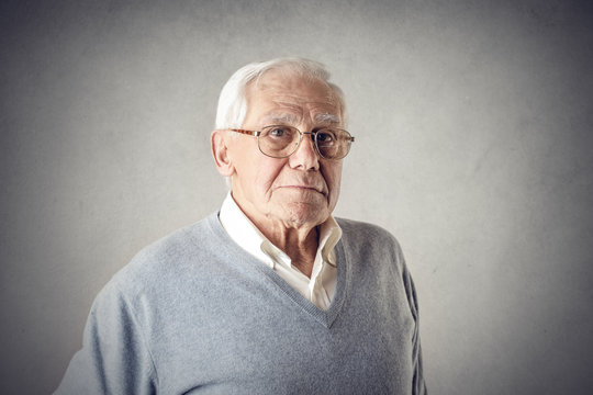 Elderly man posing for a picture