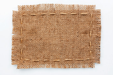 Frame of burlap, lies on a background of burlap  with place for