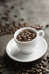 Fototapeta na wymiar Roasted coffee beans with coffee cup