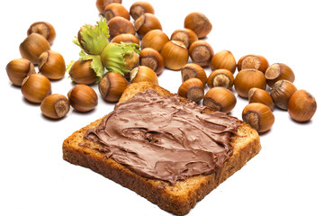 Bread with sweet chocolate hazelnut spread isolated on white