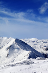 Fototapeta na wymiar Snowy mountains at sunny day