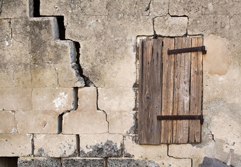 Old window of a cracked house