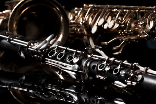 saxophone and clarinet in black background