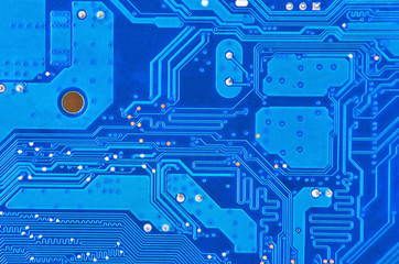 Close up of a printed blue computer circuit board