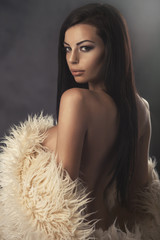 Sexy strict woman with sheepskin coat