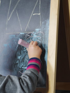 Child writing chalk