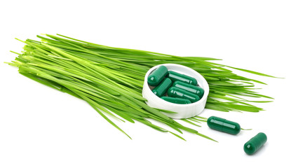 Green grass, tablets, pills and capsules
